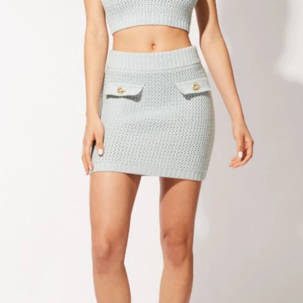 Solid and striped Ronnie skirt in powder blue. NET SZ M